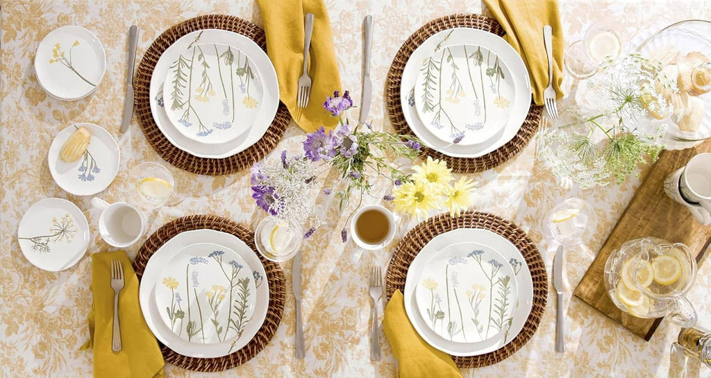 Wildflower dinnerware set with small plates featuring green stems and blue blooms