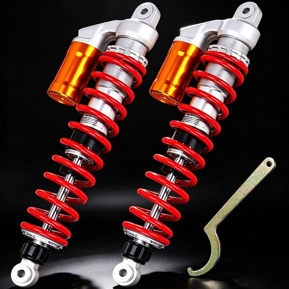 Front suspension shock pair with orange reservoirs, red coil springs, silver body and wrench