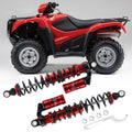 Pair of red adjustable rear shock absorbers with black coil springs and mounting hardware