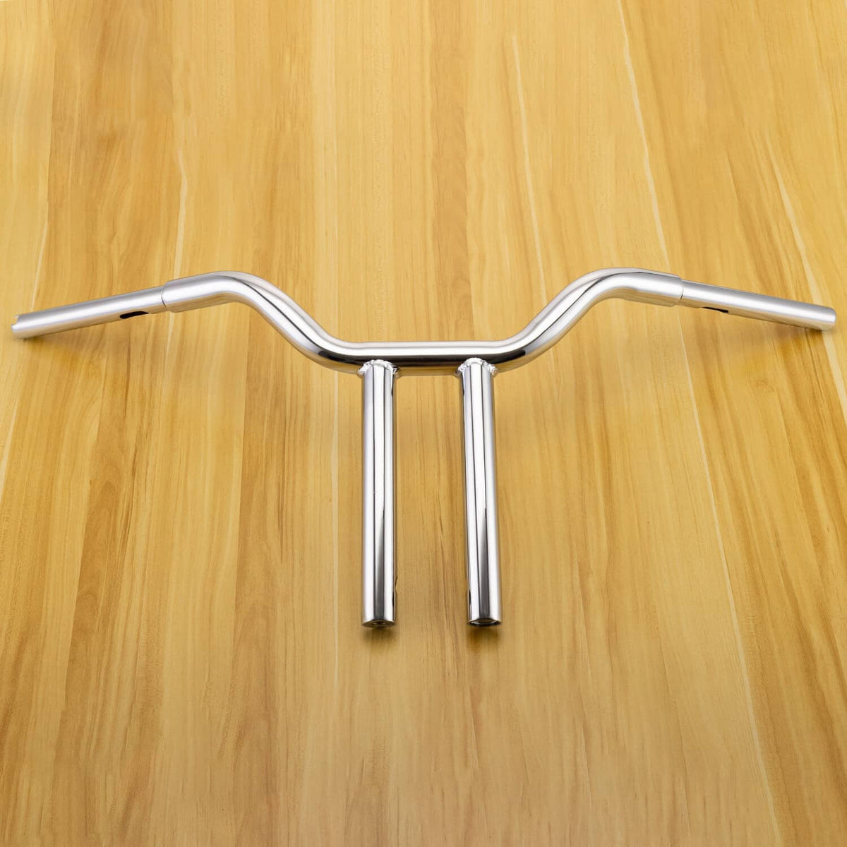 Chrome motorcycle handlebar with central crossbar and two tube risers