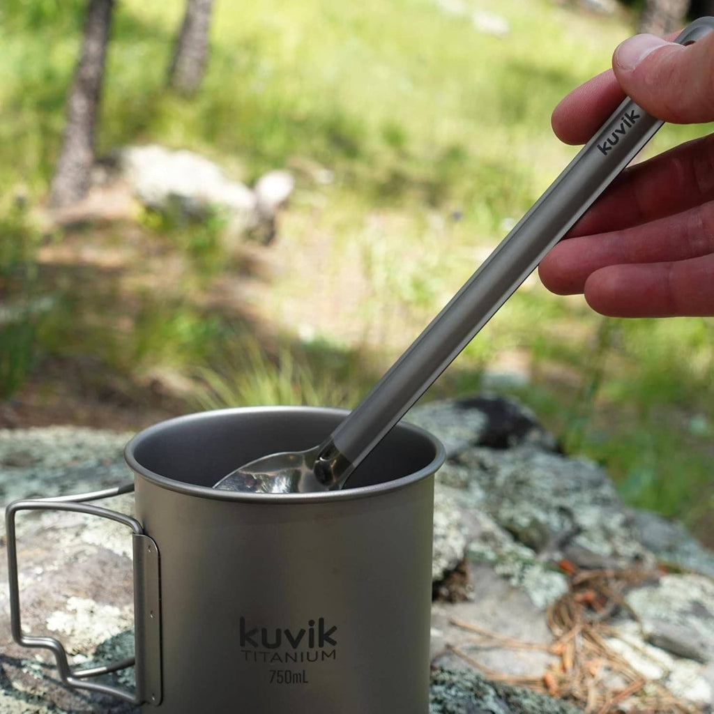Kuvik titanium spoon stirring in camping cup