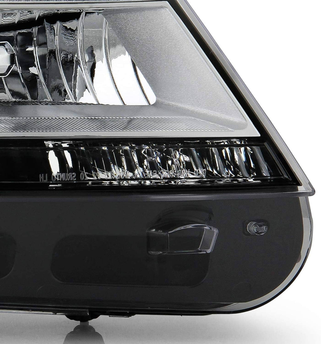 Close-up of chrome headlight lens and reflector in dark housing