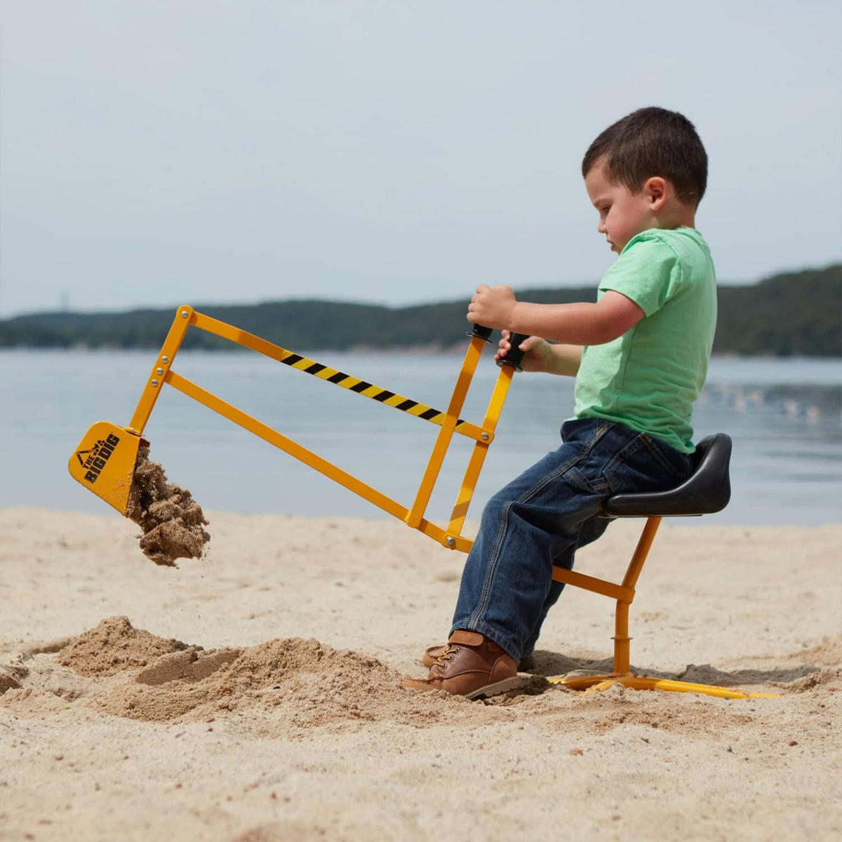 Yellow digger playset with rotating frame, wide bucket, and black seat for kids.