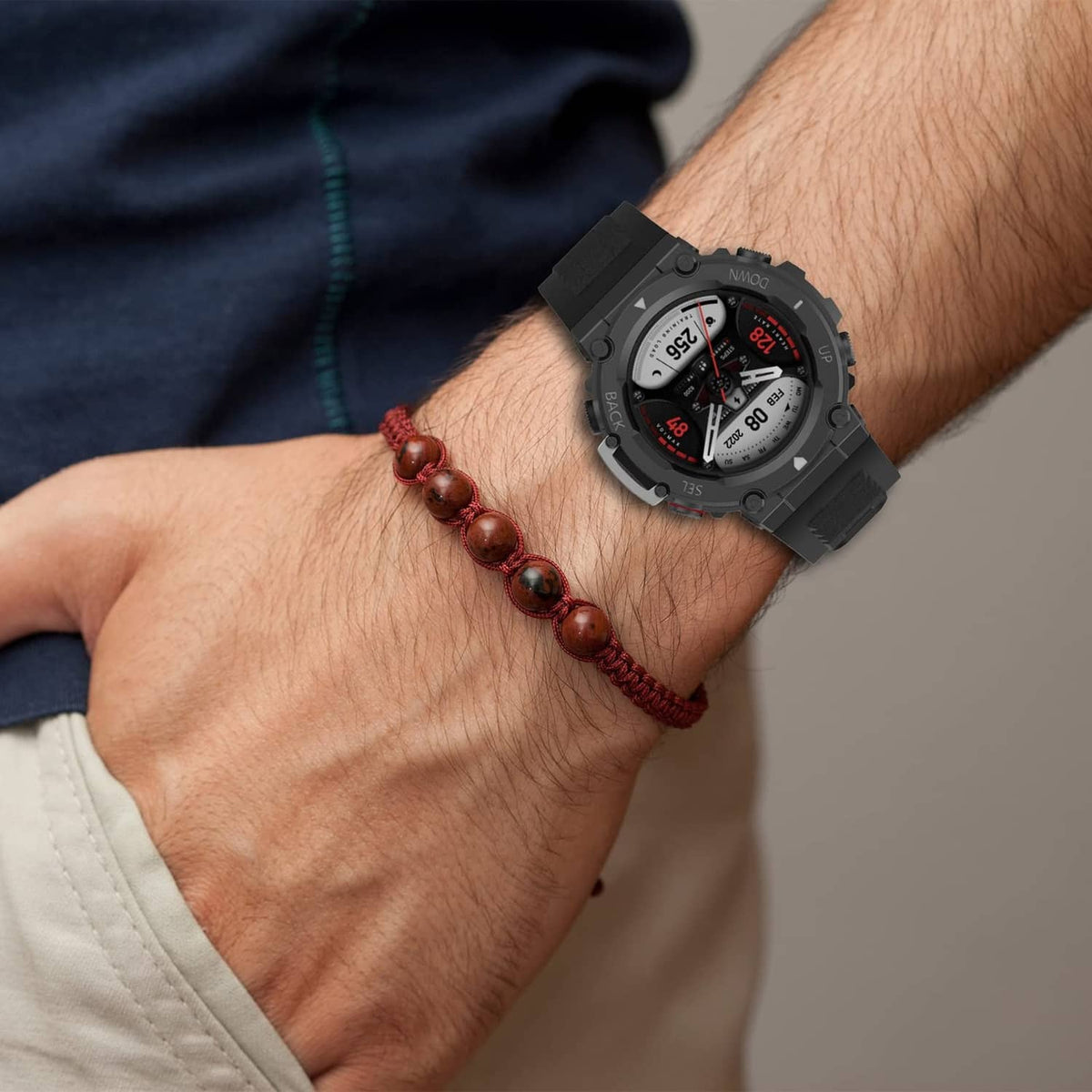 Black sports watch band on wrist with watch face visible