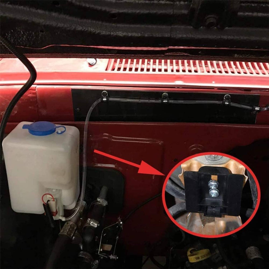 Installed windshield washer reservoir tank with blue cap and pump near wiper area