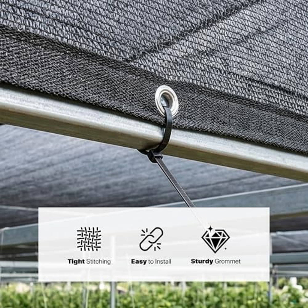 Black shade cloth edge with metal grommet fastened to a horizontal bar