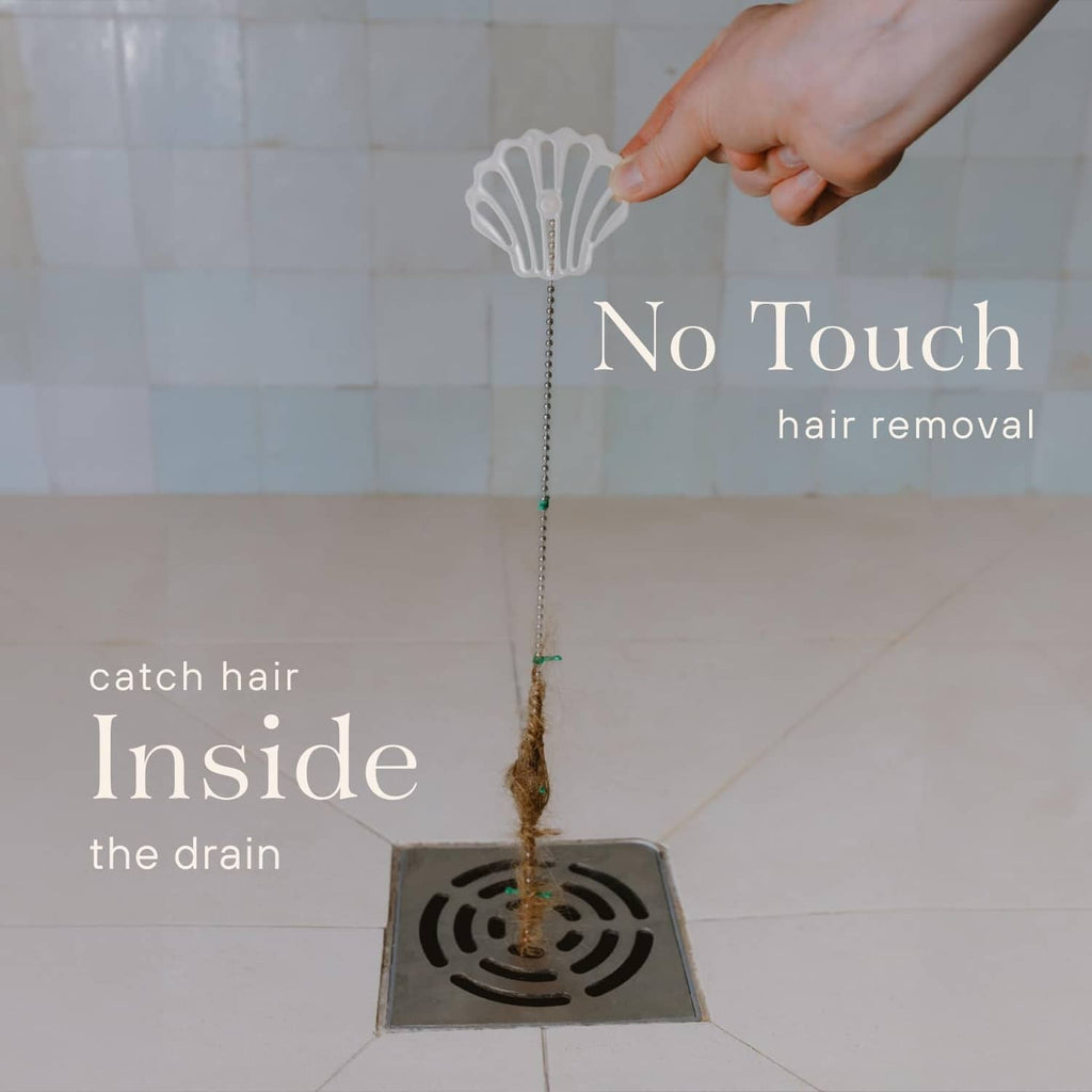 Shower drain hair catcher with white shell top and dangling chain to catch hair
