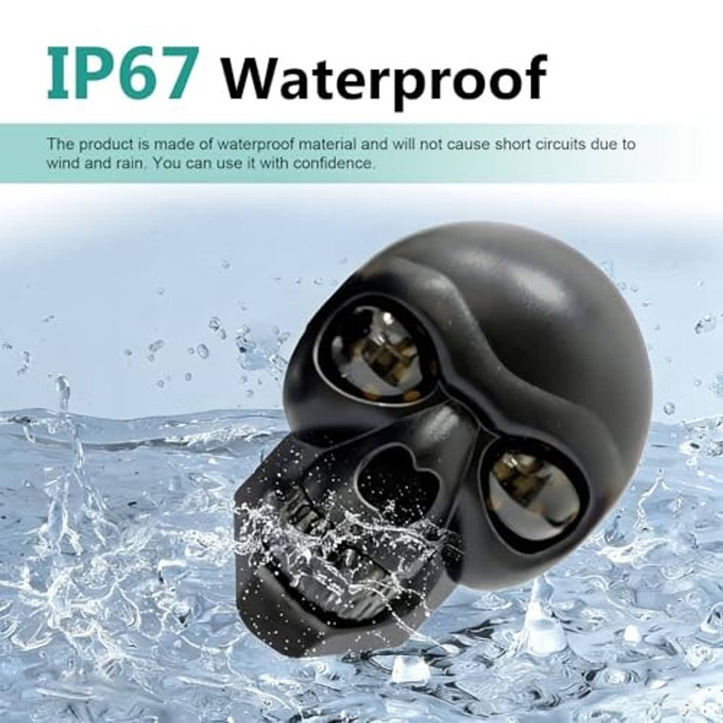 Black skull LED turn signal light pair with amber bulbs and waterproof housing