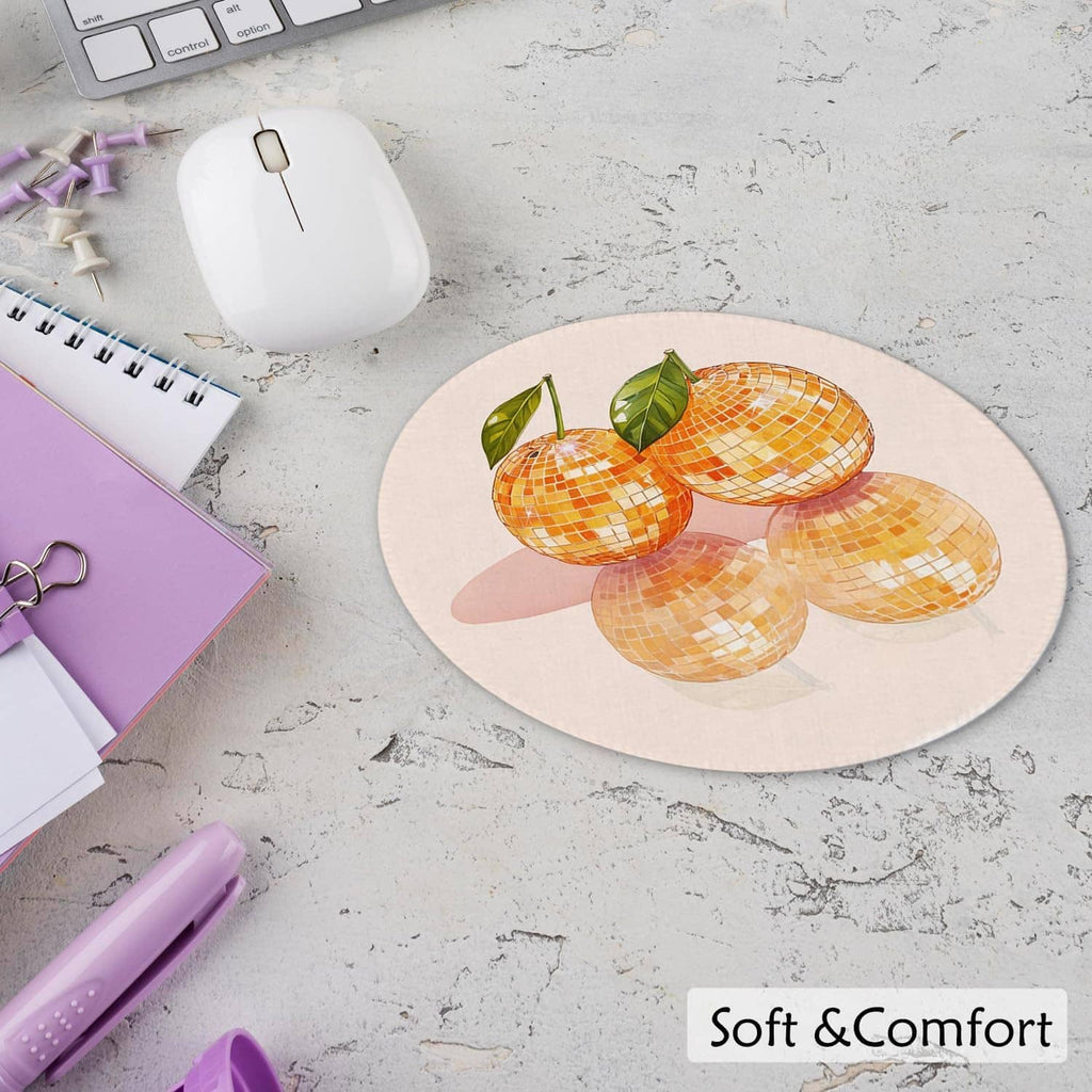 Round mouse pad with orange disco ball motif, green leaves, and Soft & Comfort text