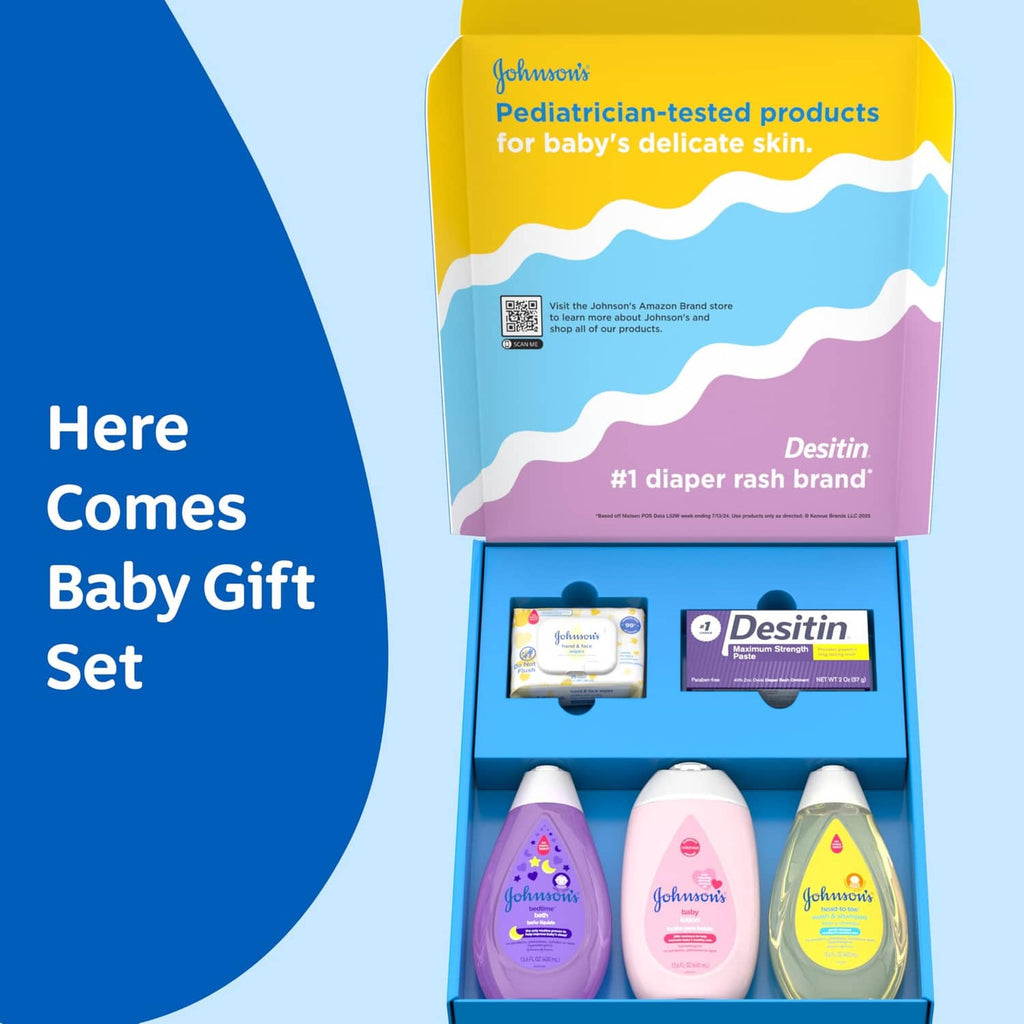 Open baby gift set box with purple, pink, yellow bottles, Desitin tube, and wipes