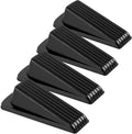 Four-piece set of black rubber door stoppers with ridged tread and raised toe.