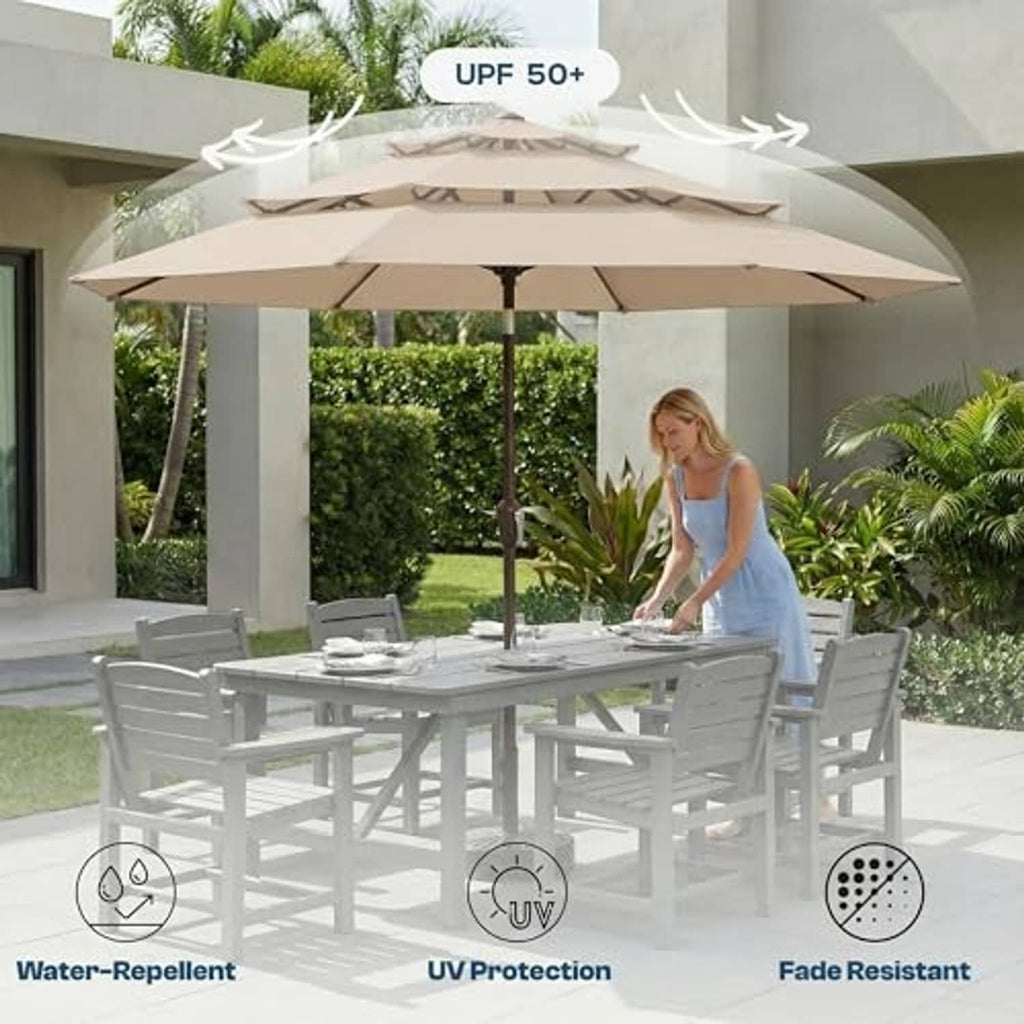 Outdoor patio table umbrella with beige 3-tier canopy and dark pole