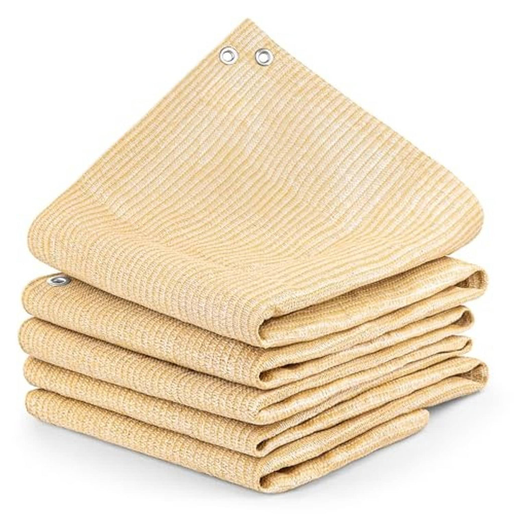 Desert sand shade cloth stacks, triple-folded fabric with visible grommet holes on edges.