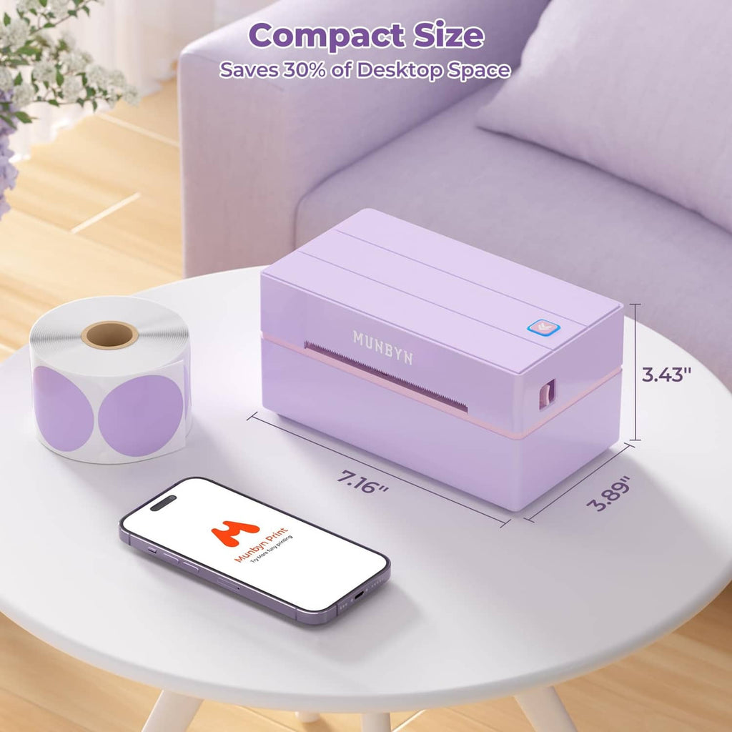 Compact purple thermal label printer with label roll and smartphone nearby