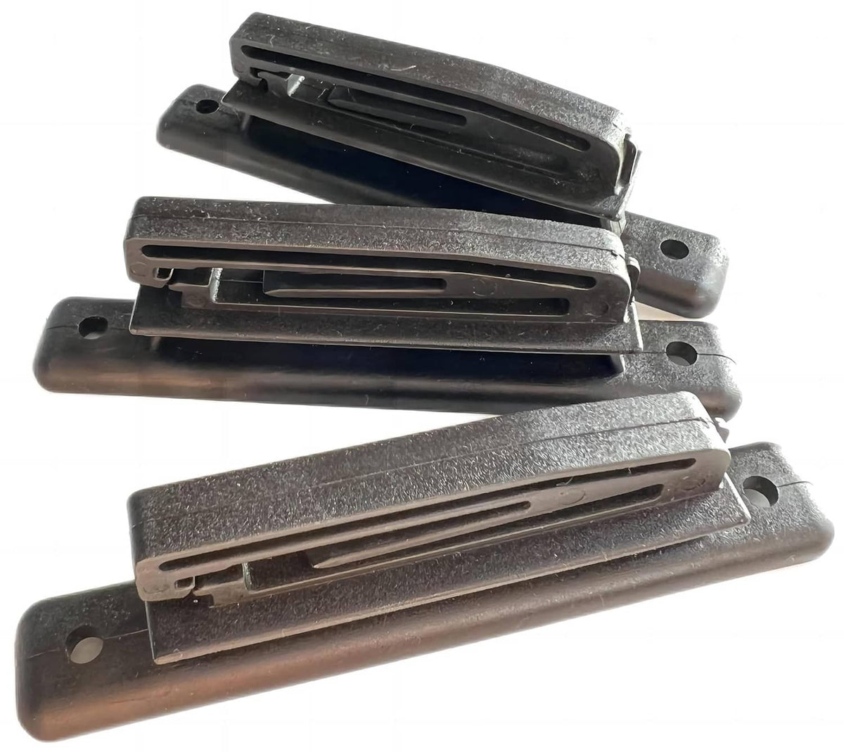 Electric fence polytape insulator pieces with black tape channels and screw holes