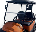 Clear foldable golf cart windshield with black frame on a golf cart