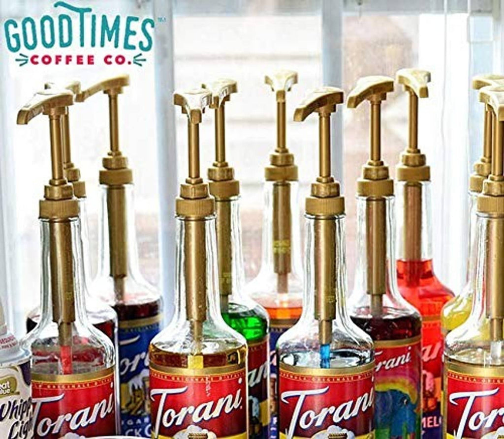 Gold syrup pump dispensers mounted on glass bottles for coffee syrup