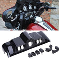 Black motorcycle inner fairing switch cap cover area with cutouts around controls