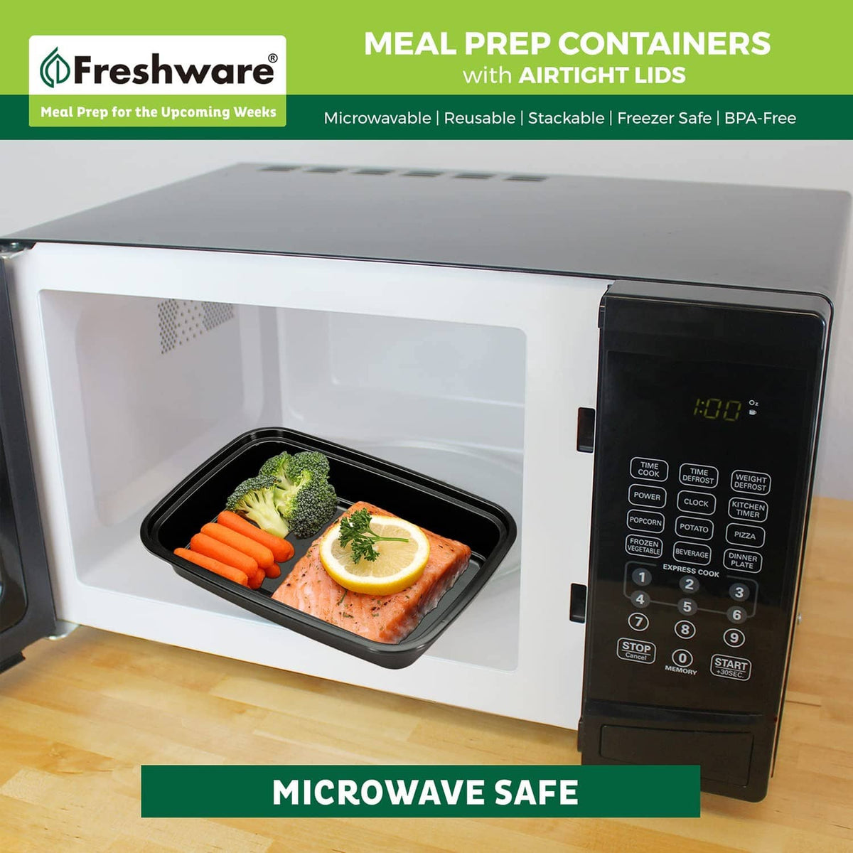 Black 16 oz meal prep container with airtight lid inside microwave, holding prepared food