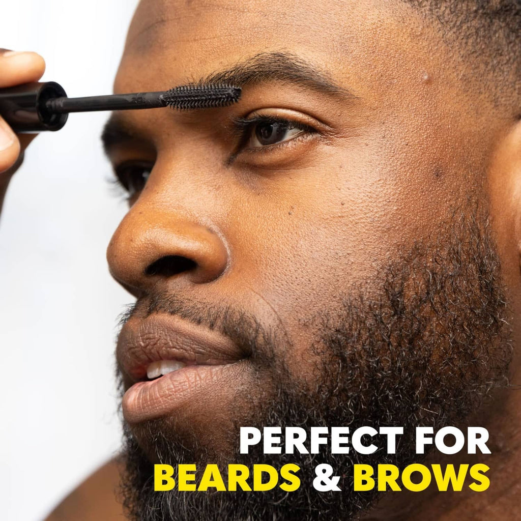 Temporary beard dye being brushed onto a trimmed beard along the jawline