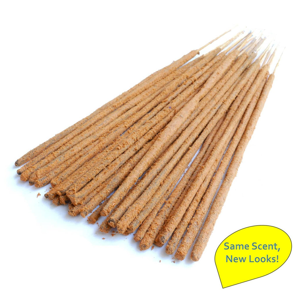 Bundle of tan masala incense sticks, fanned arrangement with pointed tips.