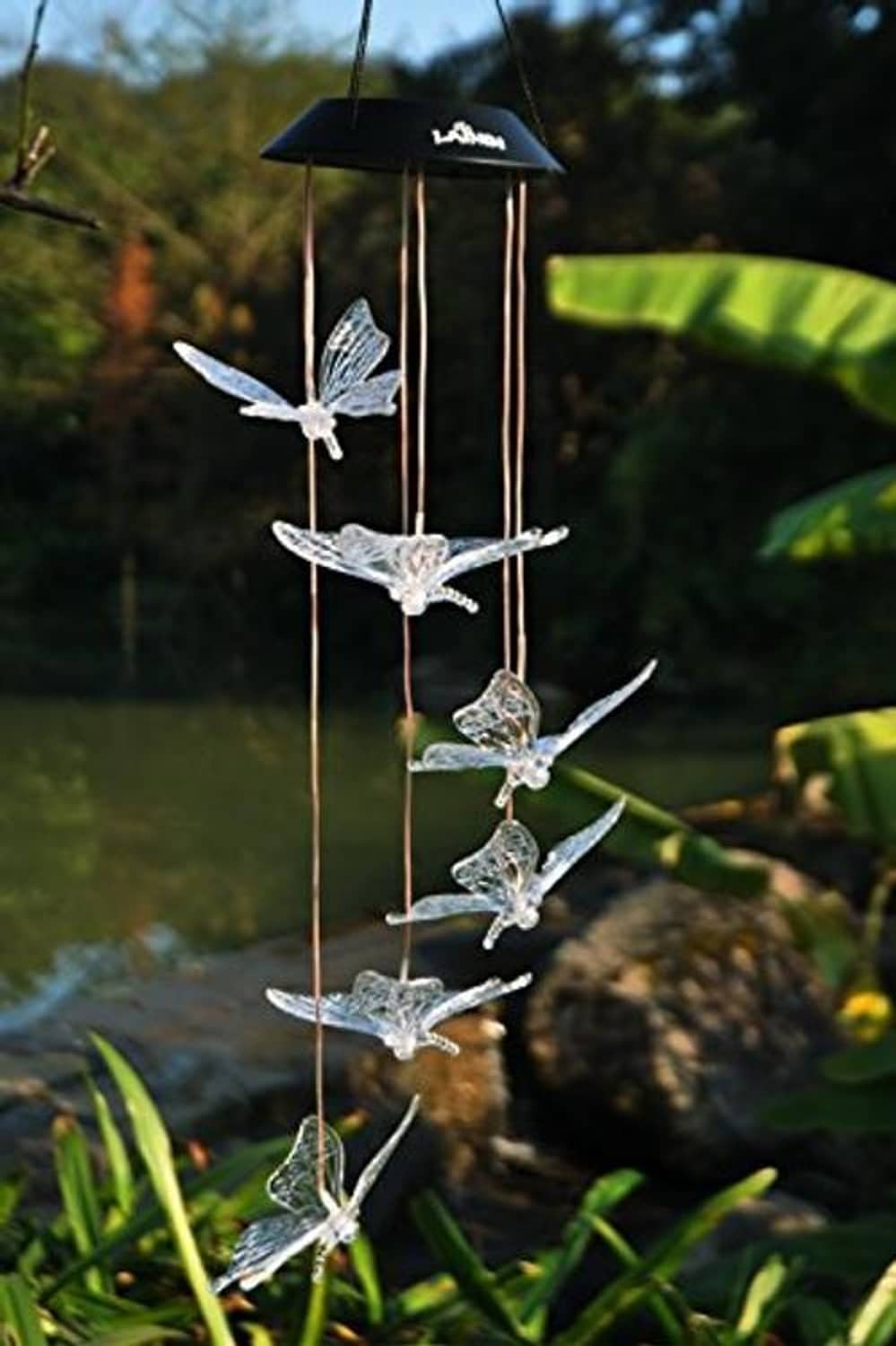 Silver glitter butterfly solar wind chime hanging from a small black lantern top