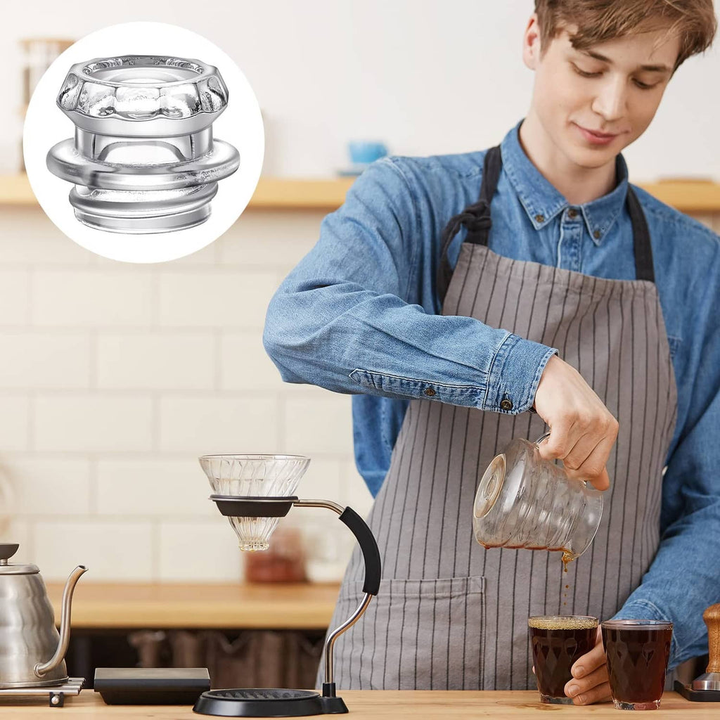 Barista pouring coffee while showing a metal and clear glass replacement percolator top