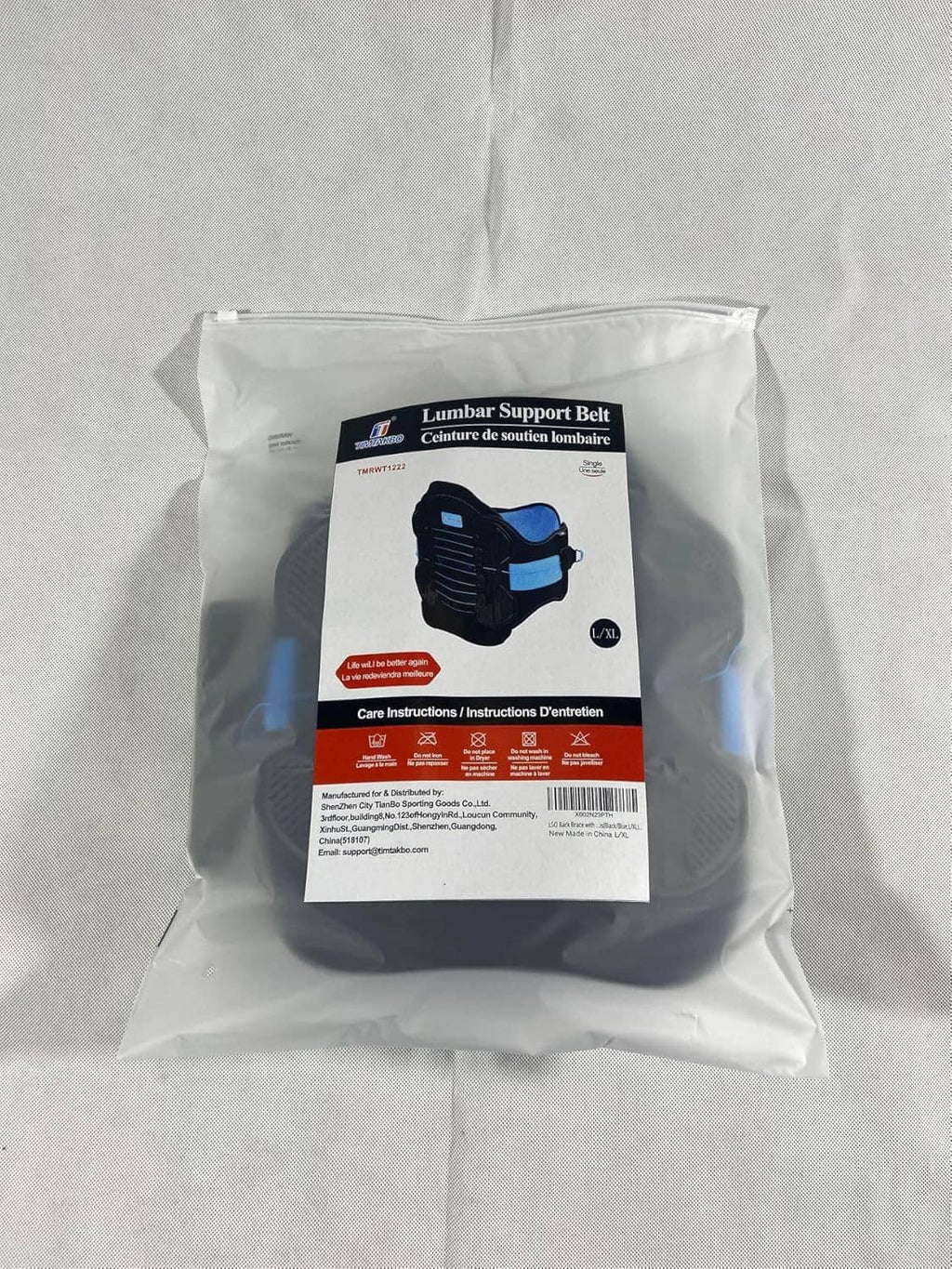 Lumbar support belt package in a clear bag with blue label