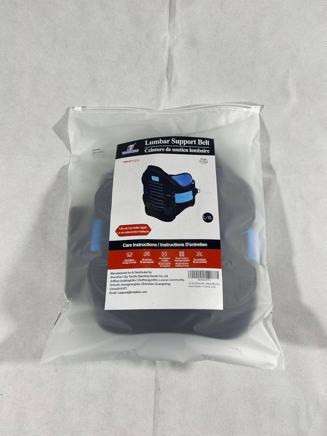 Lumbar support belt package in a clear bag with blue label