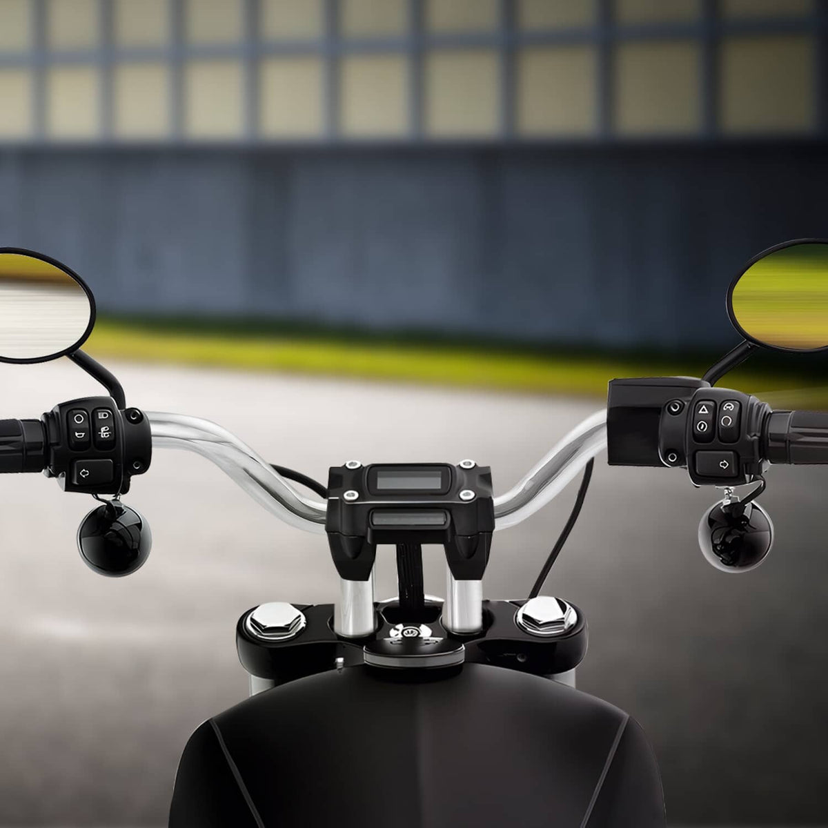 Chrome MX T-bar handlebar installed with switch housings and instrument mount
