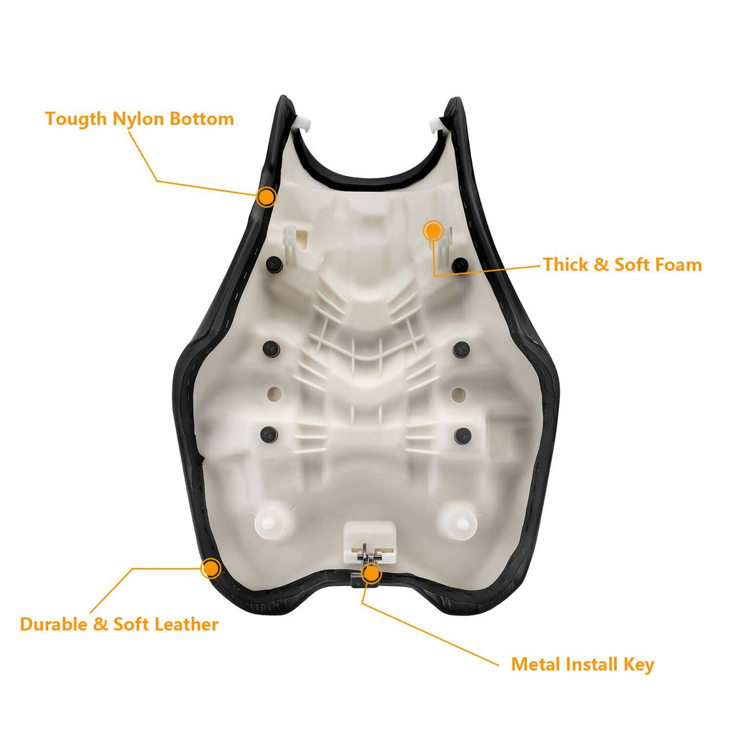White underside panel with black trim for ATV seat, with foam and leather layers shown