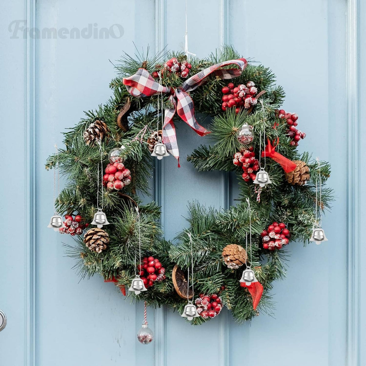 Mini silver jingle bells hanging on a Christmas wreath decoration