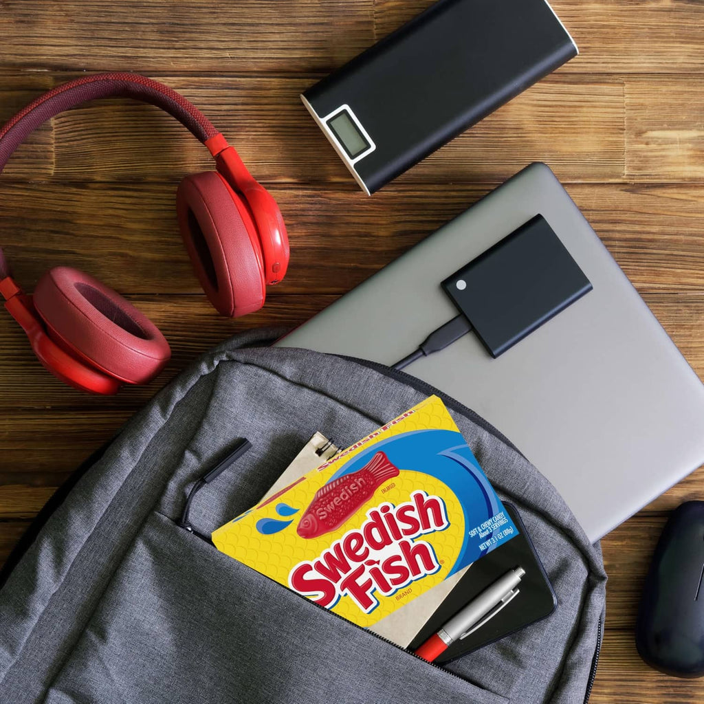 Swedish Fish candy box tucked in gray pouch with headphones and TV stick