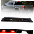 Mounted LED third brake light bar with red LED segments on pickup tailgate