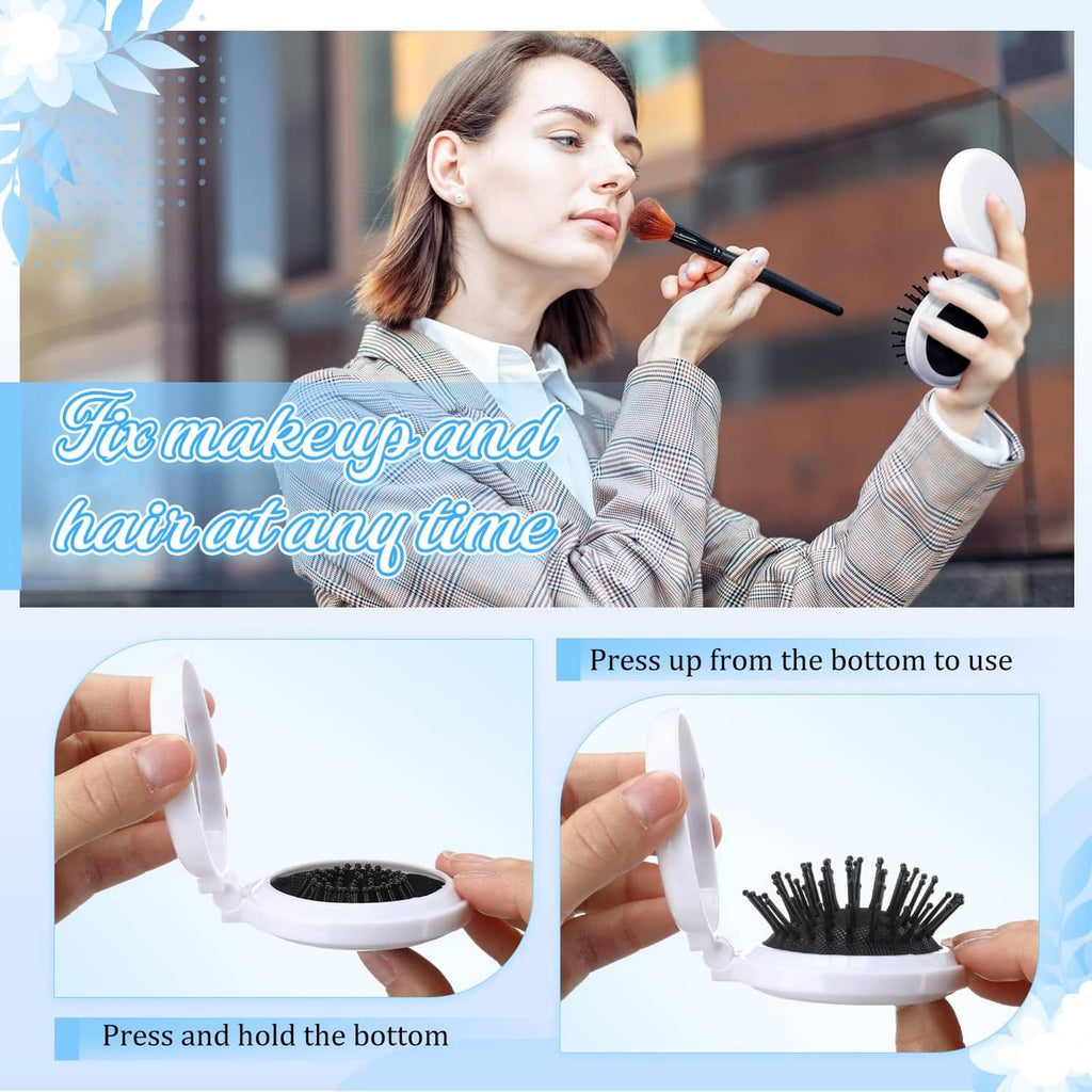 White mini folding hair brush with mirror, black bristles, held for styling