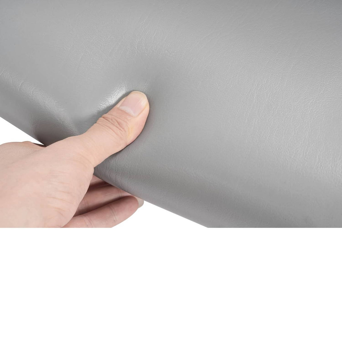 Light gray tractor seat cushion with textured surface and hand grip area