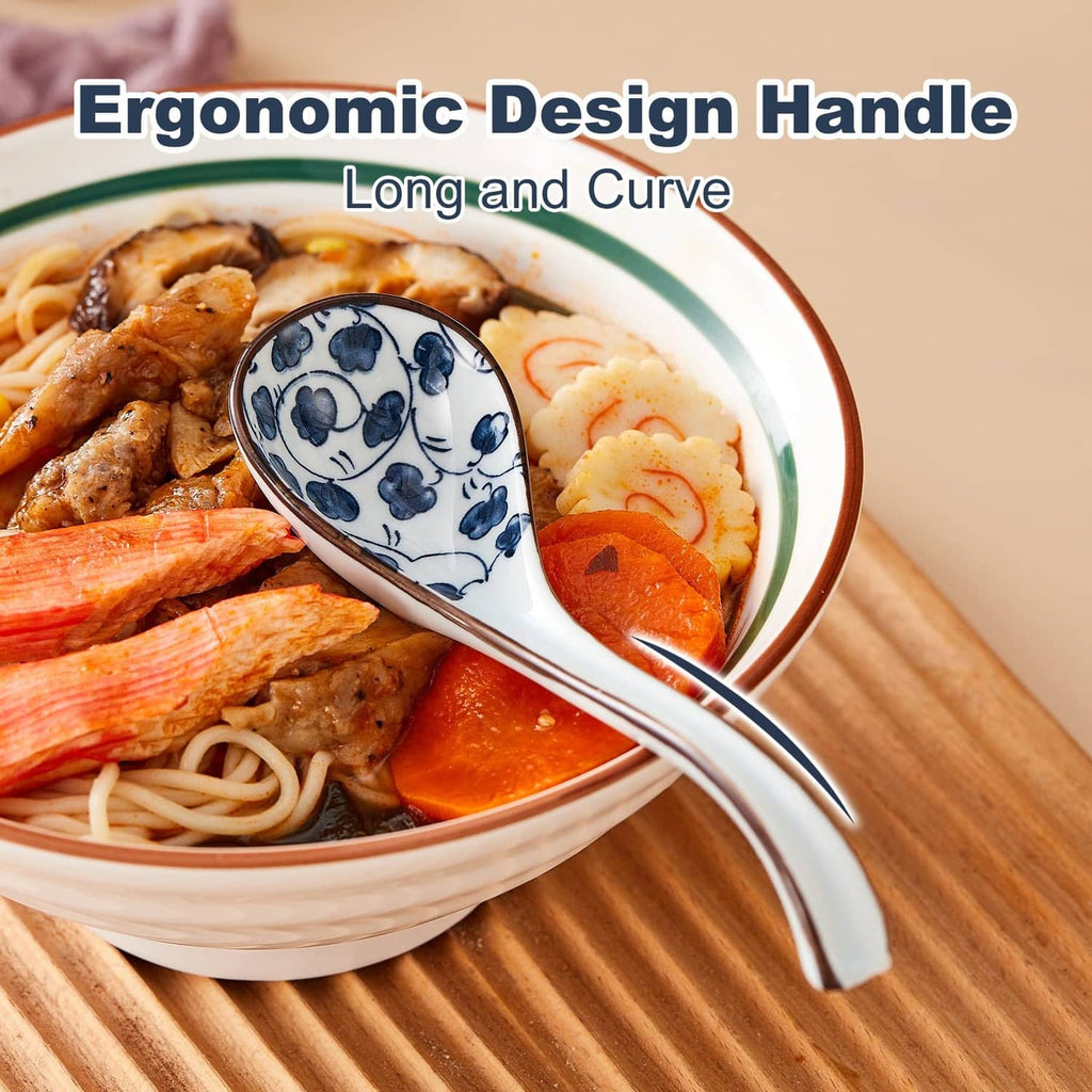 Ceramic Asian soup spoon with blue-and-white patterned scoop in a noodle soup bowl