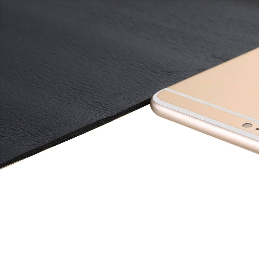 Close-up of dark gray neoprene foam rubber sheet edge and fine surface texture