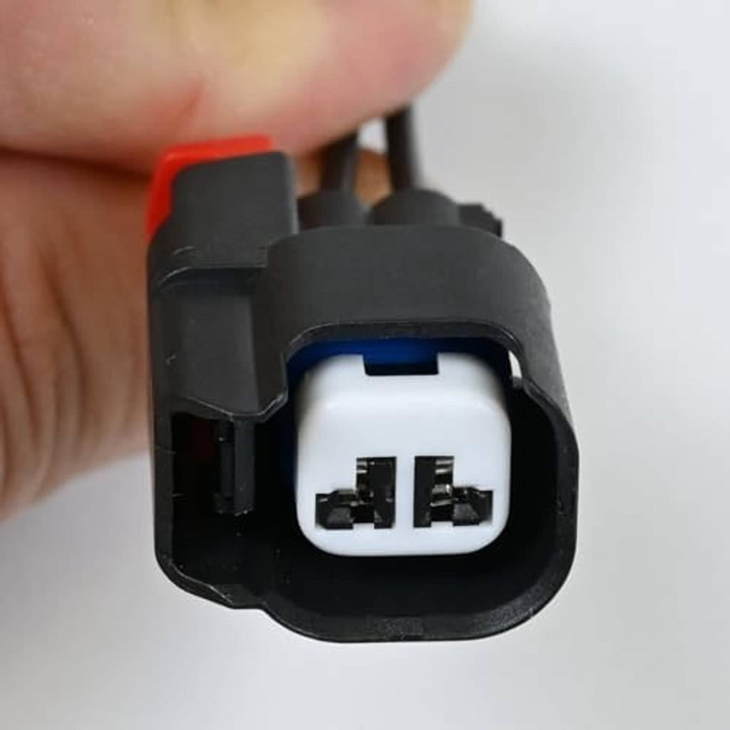 ABS wheel speed sensor connector, close-up of white two-pin socket inside black housing