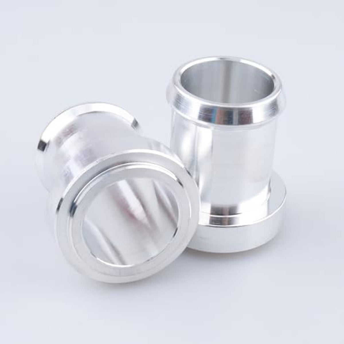 Stainless steel weldable hose barb tail fitting pair, one shown with open end