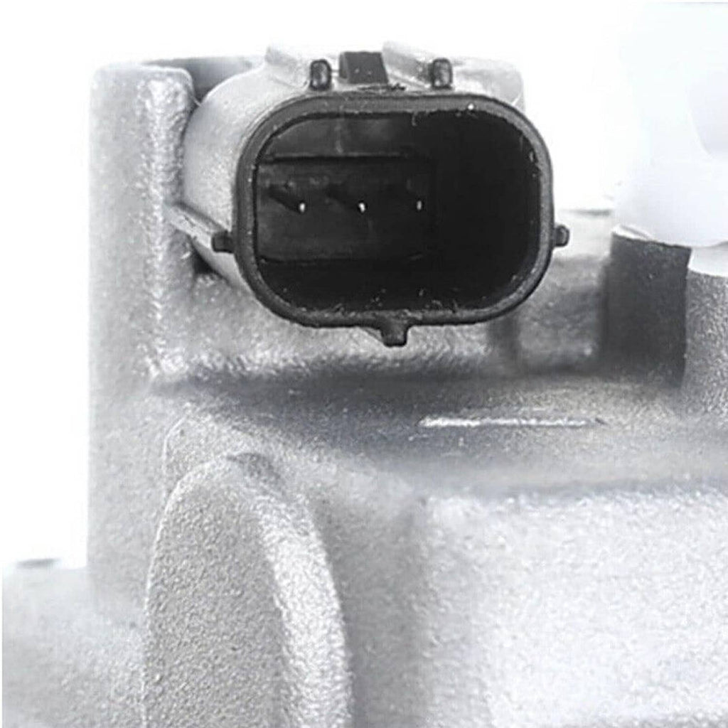 A/C air compressor electrical connector port on silver housing, close-up