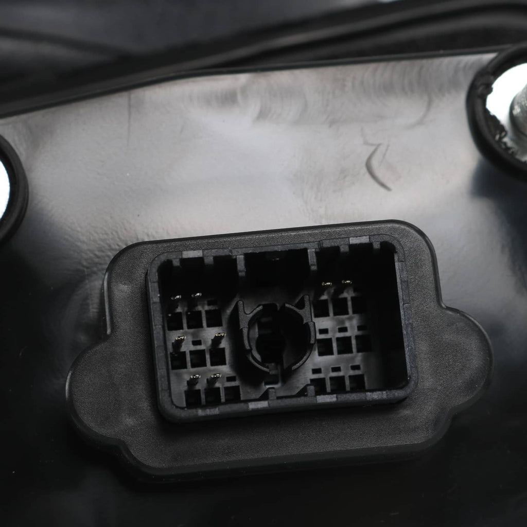 Black side mirror housing with exposed wiring connector panel and mounting clips