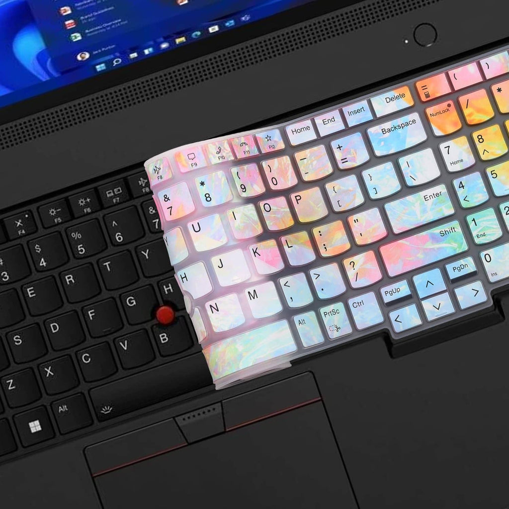 Iridescent keyboard cover partially installed over a laptop keyboard