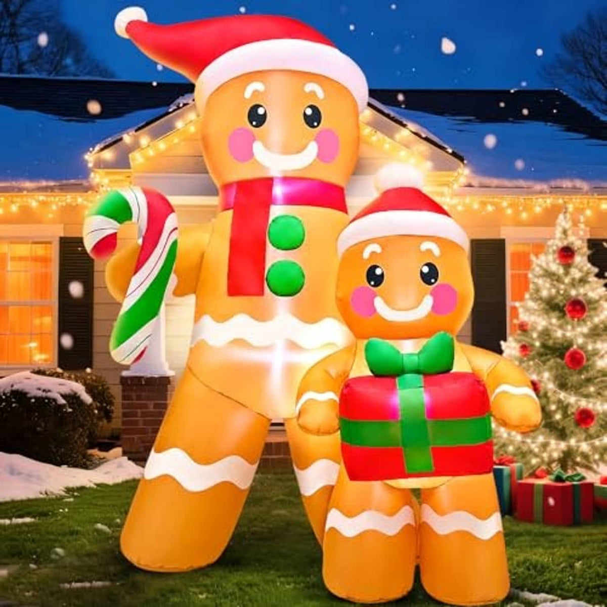 Outdoor inflatable gingerbread duo with red hats, candy cane and green-and-red gift box