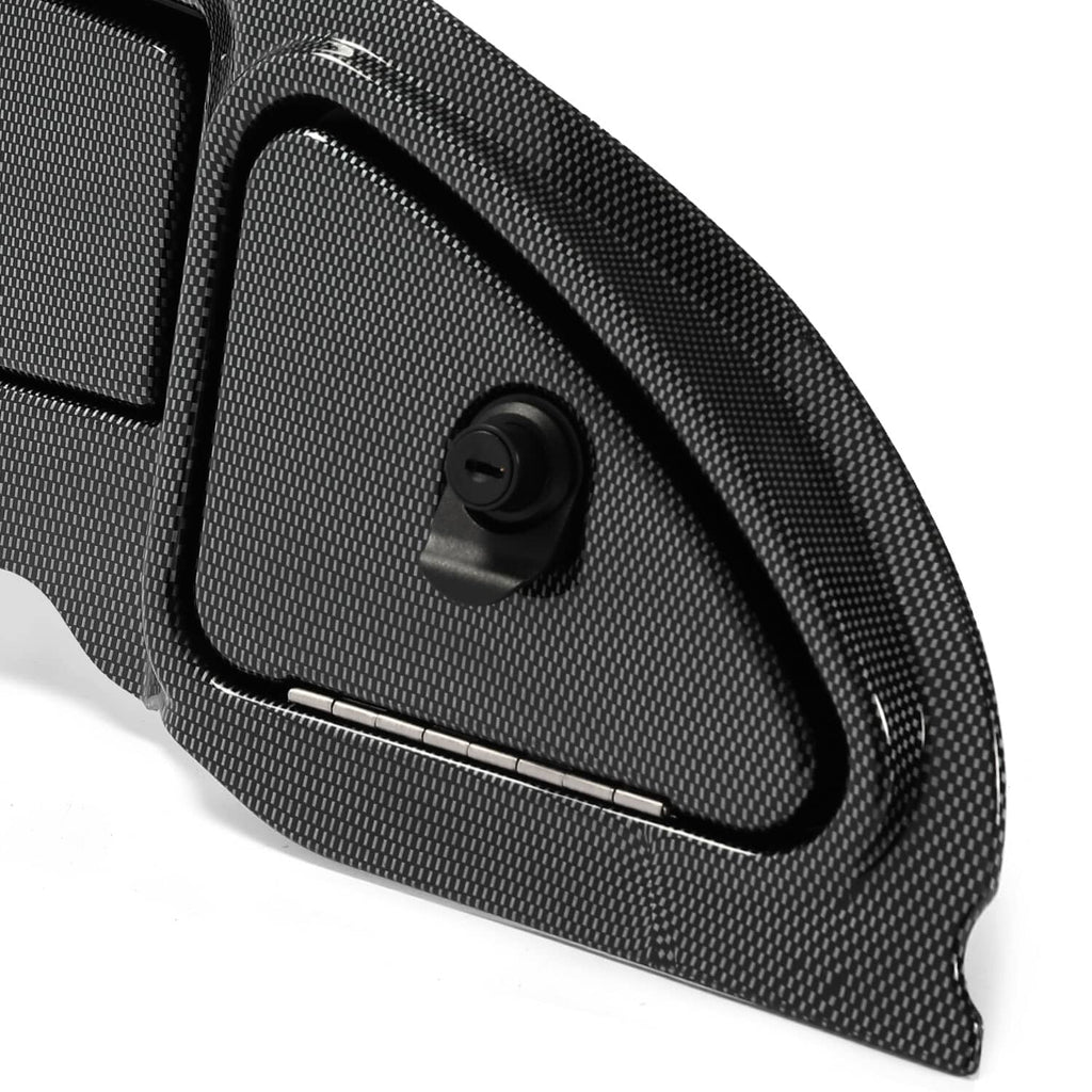 Close-up of black carbon-fiber-look dash panel with circular lock knob and side trim