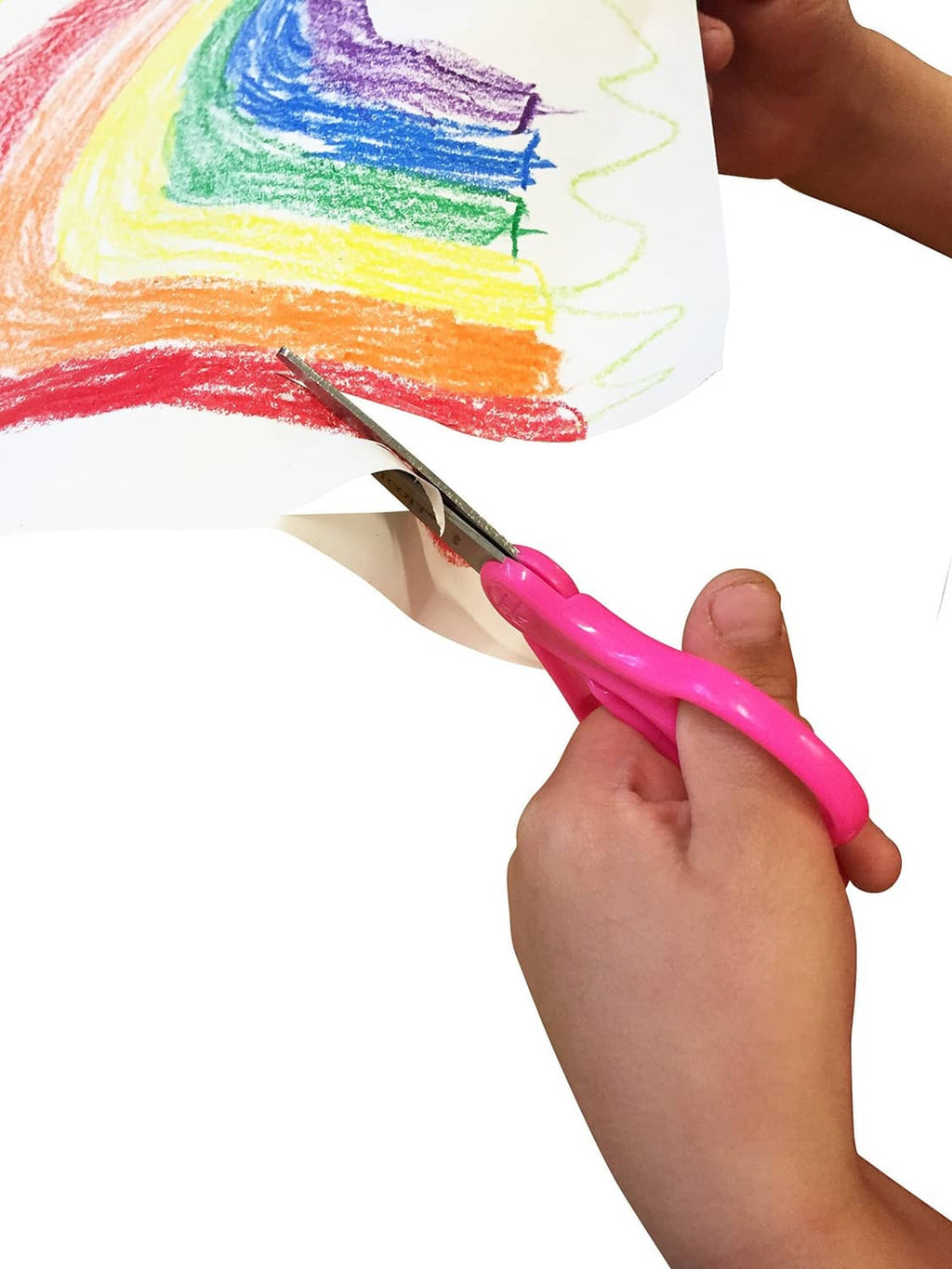 Kid using pink Westcott kids' blunt-tip scissors to cut paper for crafts