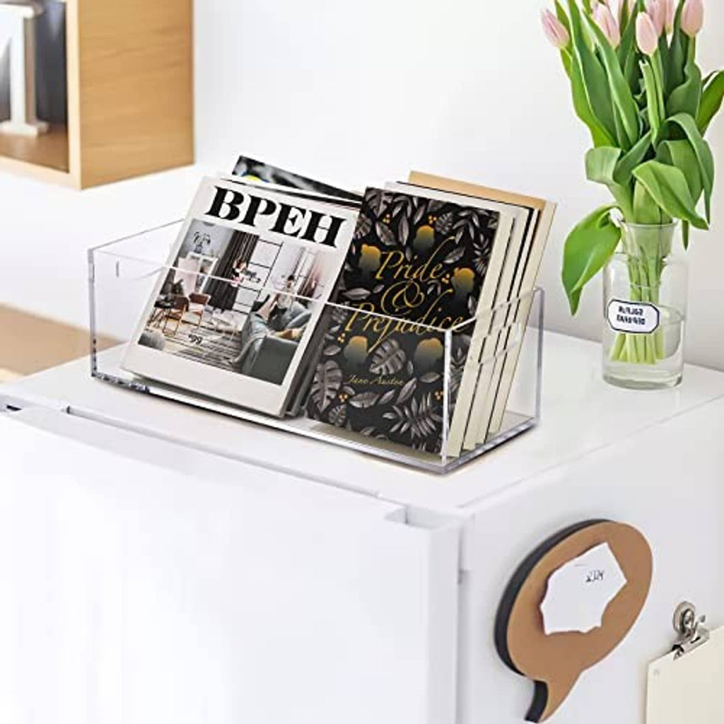 Clear acrylic storage box with handle, holding magazines or booklets