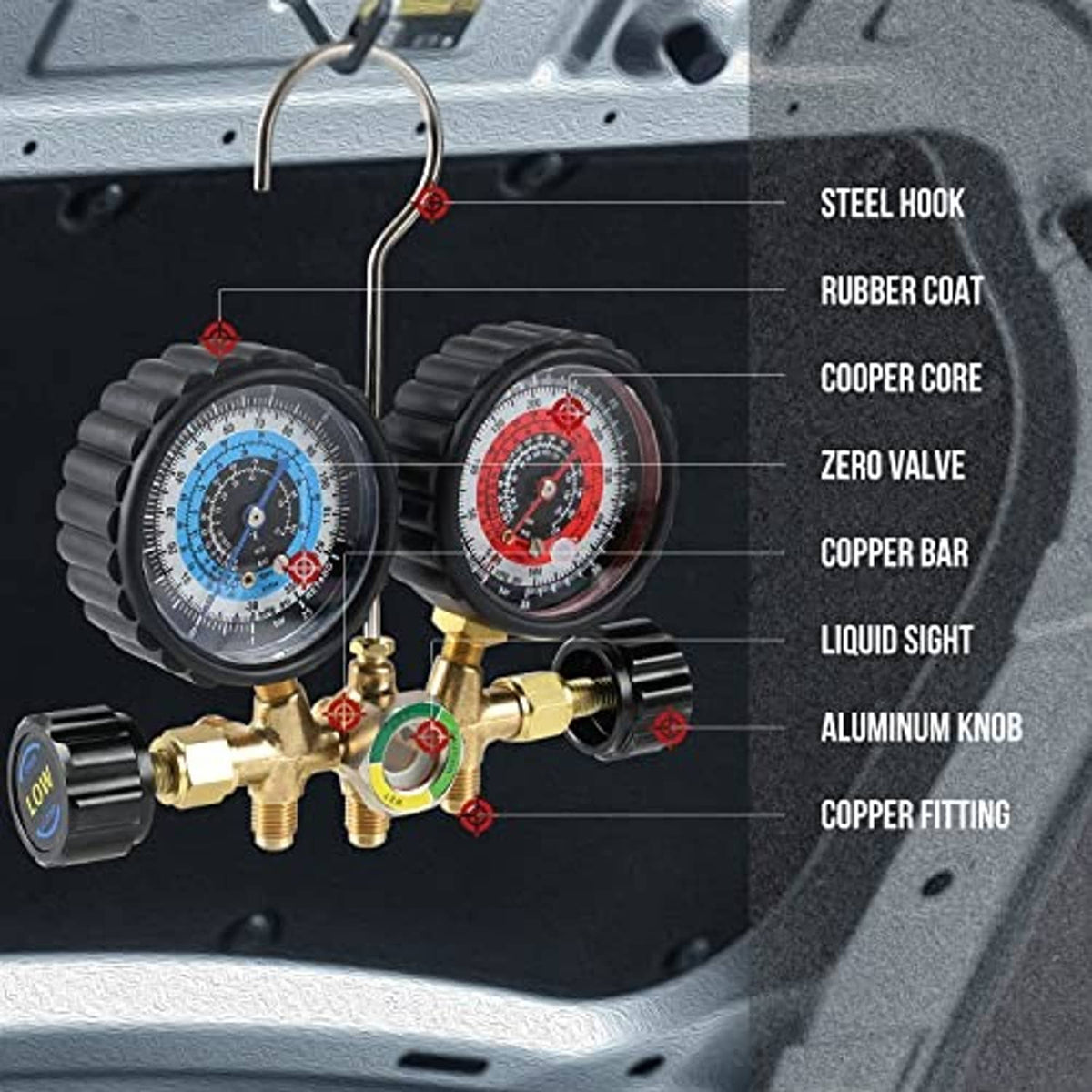 Close-up A/C manifold gauges with brass fittings and color hoses on service surface