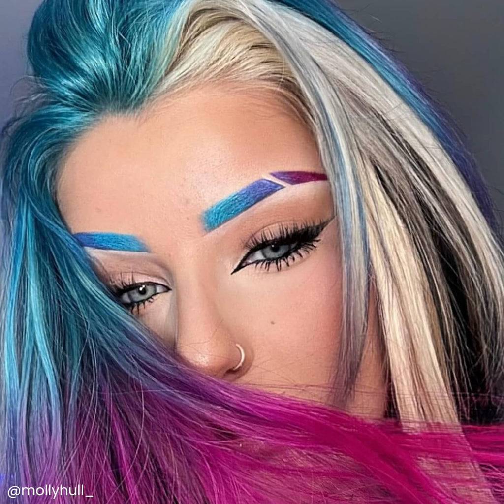 Semi-permanent hair color on blonde hair: teal blue with purple highlights