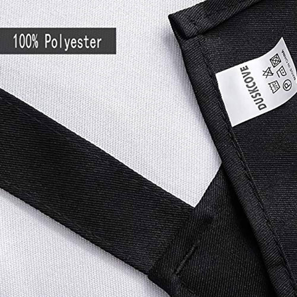 Black polyester apron fabric close-up with stitched edge and label detail